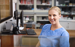 Medical Billing and Coding Professional at a desk