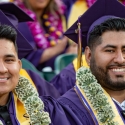 Business students wearing money leis at Commencement