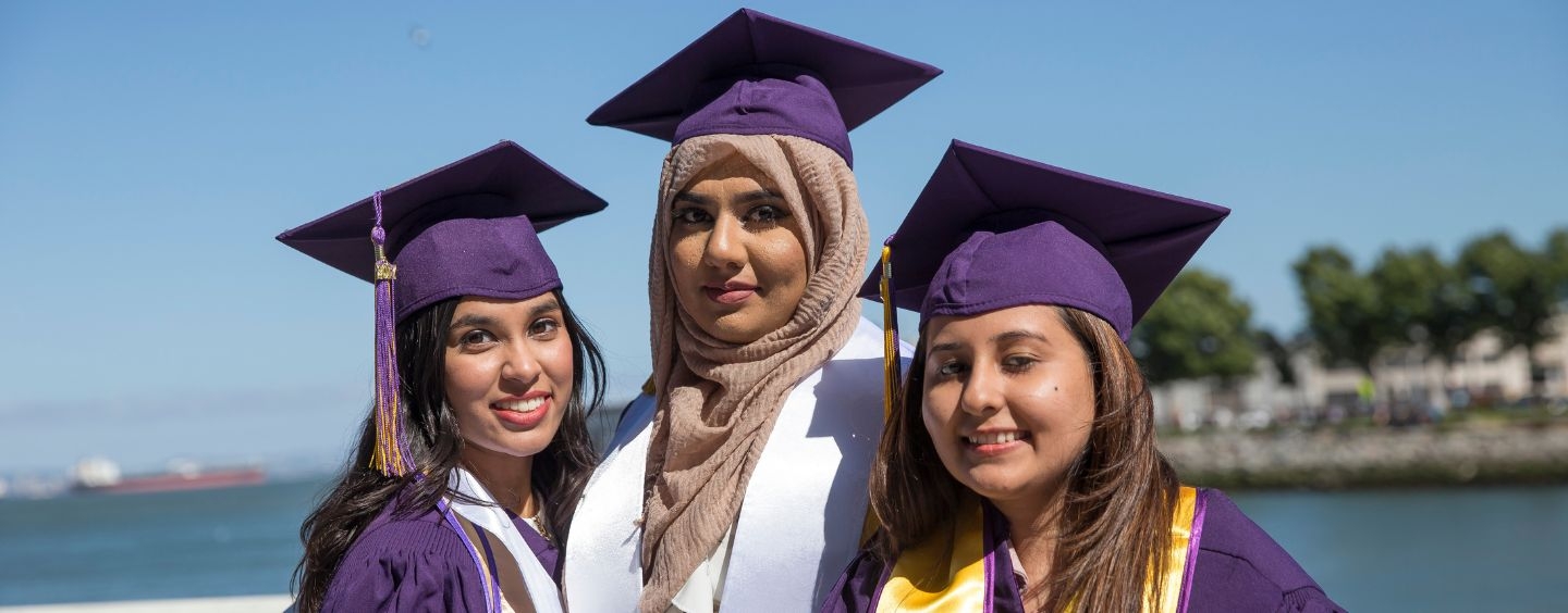 Psychology graduates on the beach