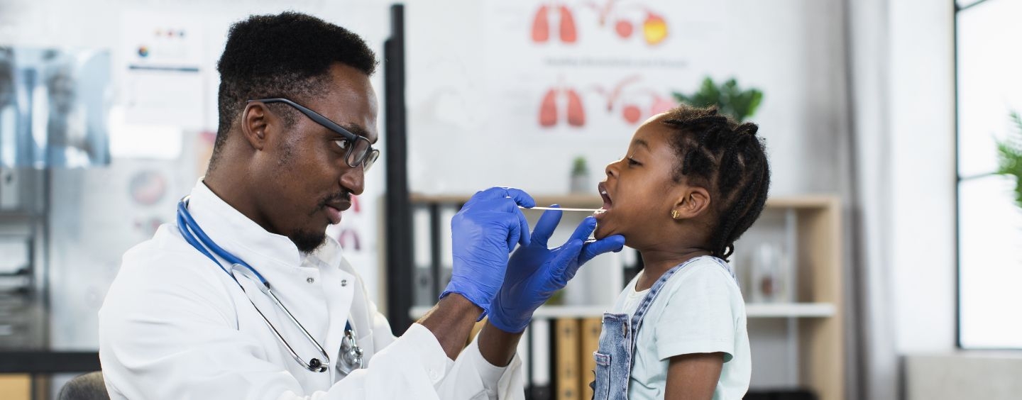 School nurse examines a student's throat