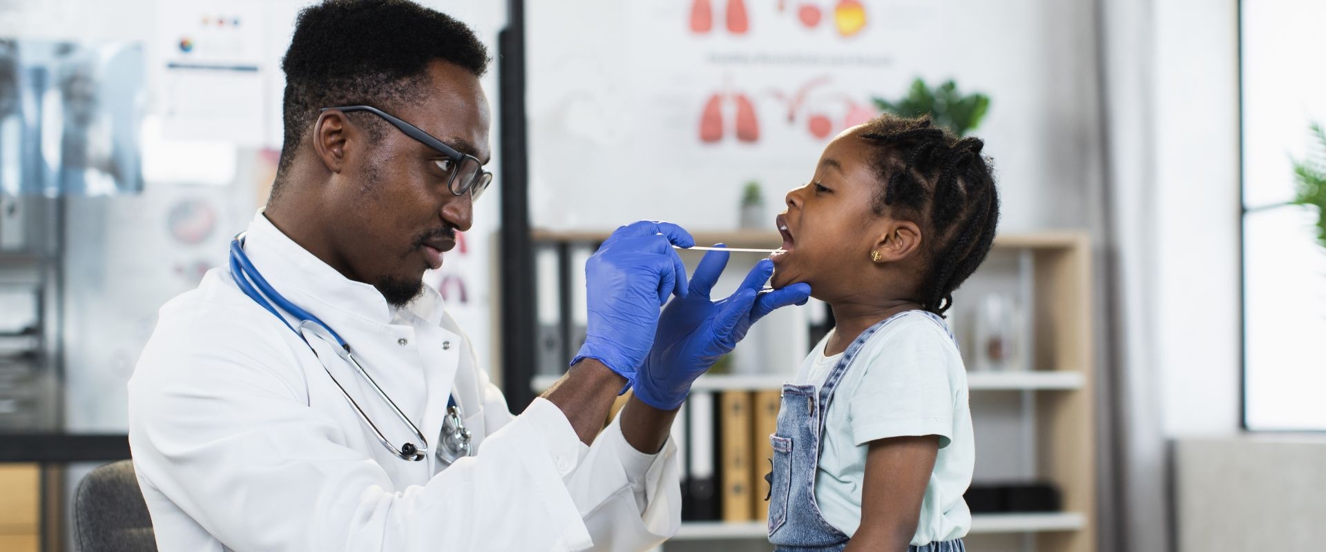 School nurse examines student's throat