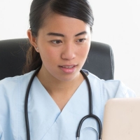 Medical assistant taking an online course