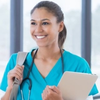 Medical student in scrubs with a backpack