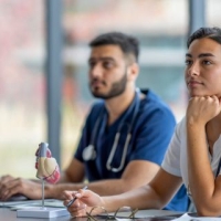 Pre-medical students listening in class