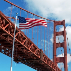 USA flag in front of Golden Gate Bridge