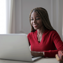 Critical Thinking student smiles while taking online class
