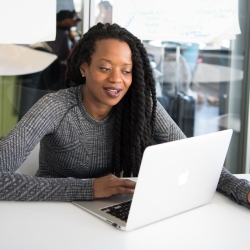 Biotech data scientist working on laptop