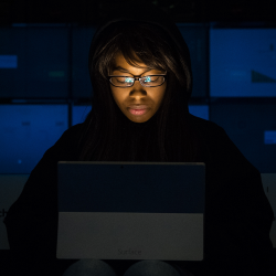 Ethical Hacker student studying in the dark
