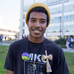Winter Session student wearing a hat on campus