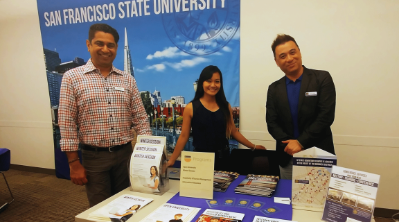 Three staff at an Open House event